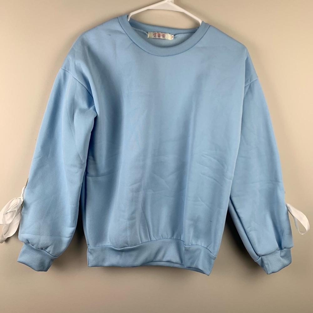 sweater with bows on the sleeves